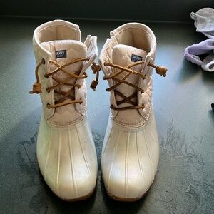 Sperry topsider boots.  Worn 4 times.  Pearlized creamy color